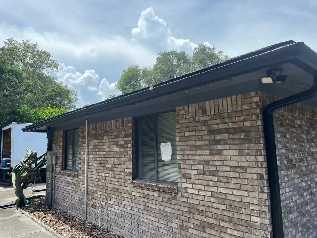 How do you unclog a downspout from the ground?