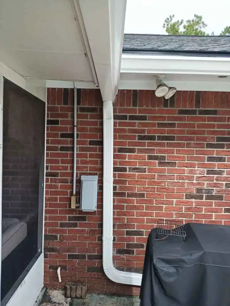 How much should I charge to replace a downspout?